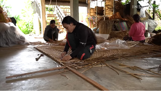 Cambodian women weave rug out of dried water hyacinth. insider business