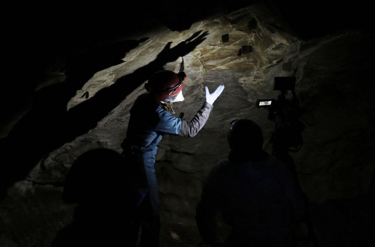 researcher in Dorset cave